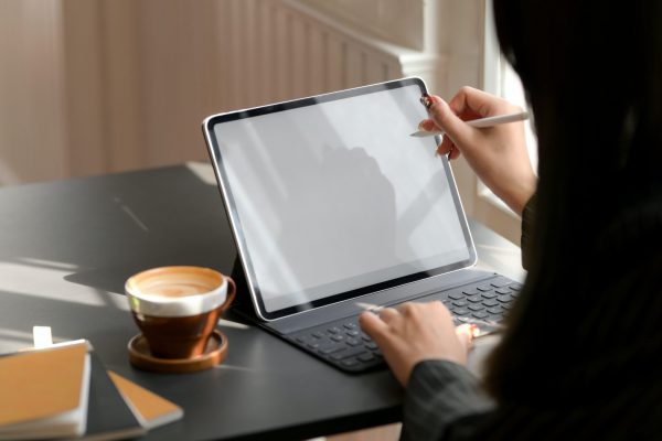 person-using-tablet-computer-with-keyboard-3815584